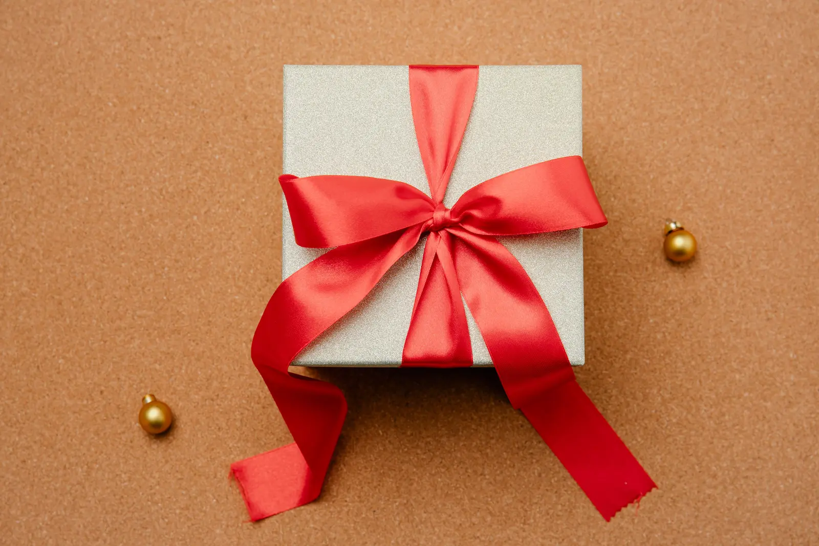 A gift box wrapped with a red ribbon, representing a credit card welcome bonus